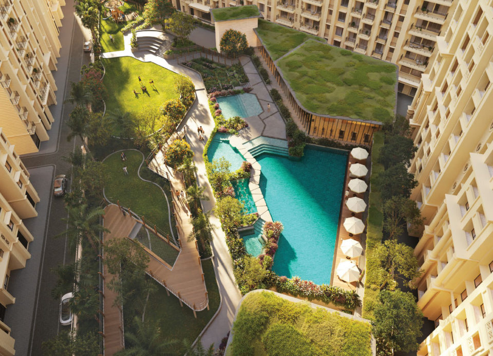 Aerial view of the podium with pool, green-roof clubhouse, lawns and wooden ramps